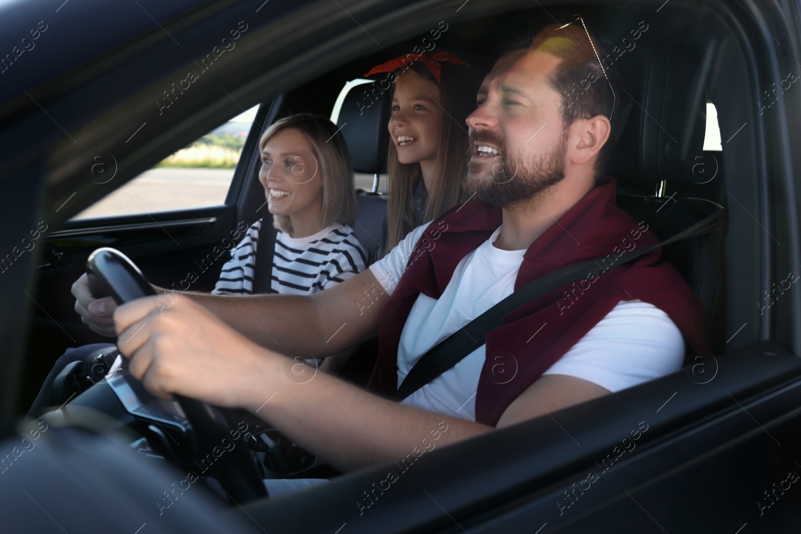 Photo of Happy family enjoying trip together by car, view from outside