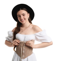 Smiling woman in velvet corset and hat posing on white background