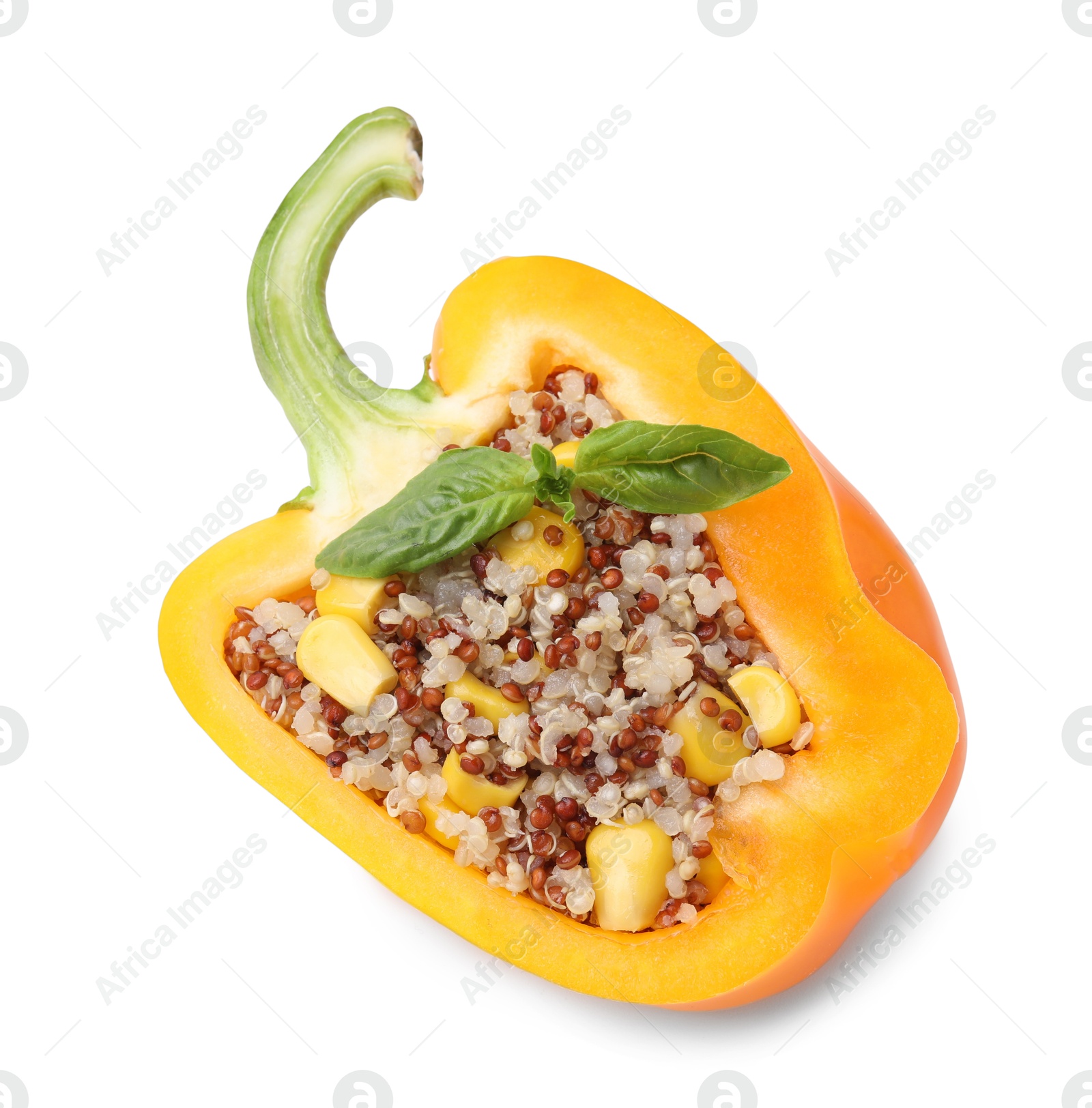 Photo of Quinoa stuffed bell pepper with basil isolated on white