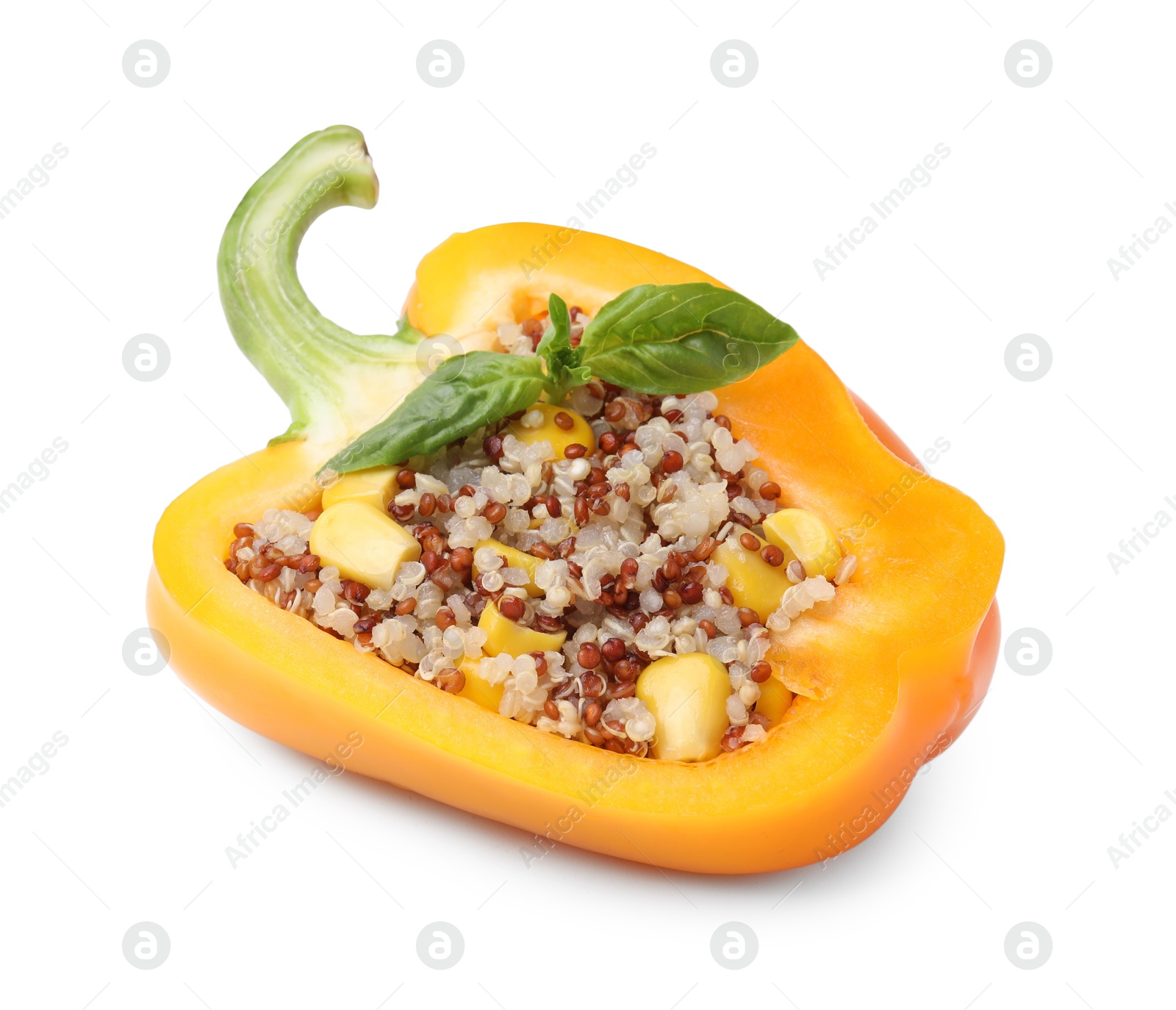 Photo of Quinoa stuffed bell pepper with basil isolated on white