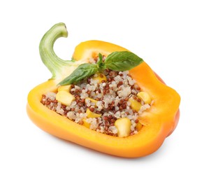 Photo of Quinoa stuffed bell pepper with basil isolated on white