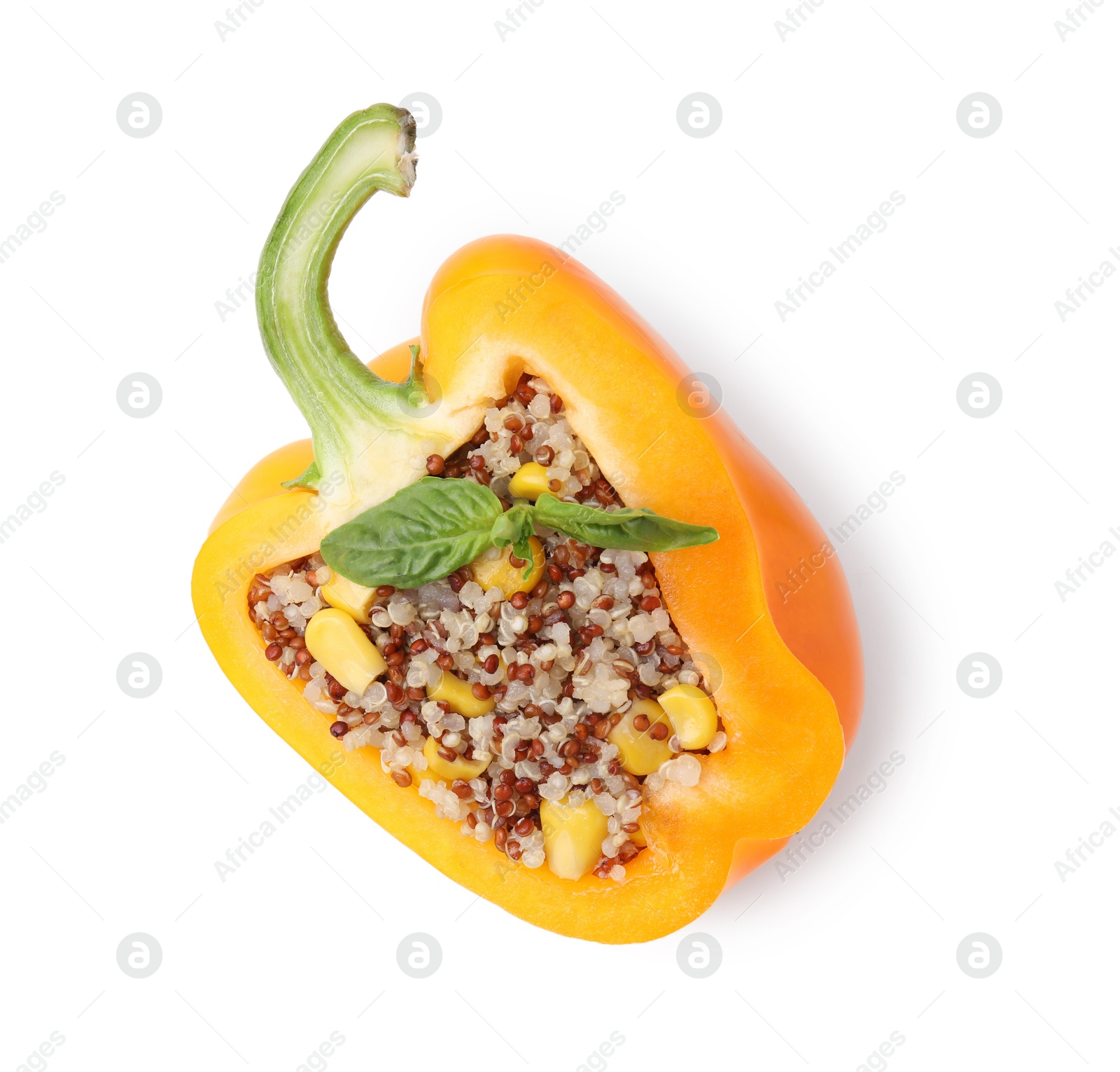 Photo of Quinoa stuffed bell pepper with basil isolated on white, top view