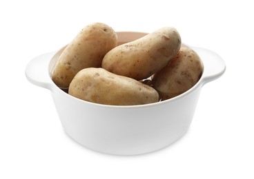 Photo of Raw potatoes in pot isolated on white