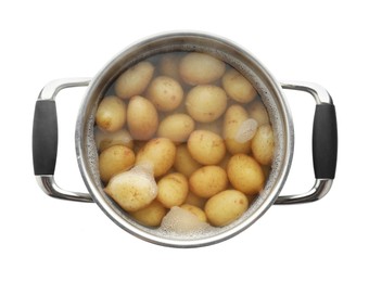 Raw potatoes in pot with water isolated on white, top view