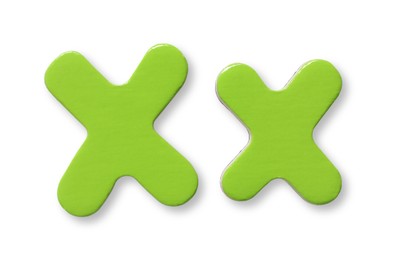 Photo of Uppercase and lowercase green magnetic letter X isolated white