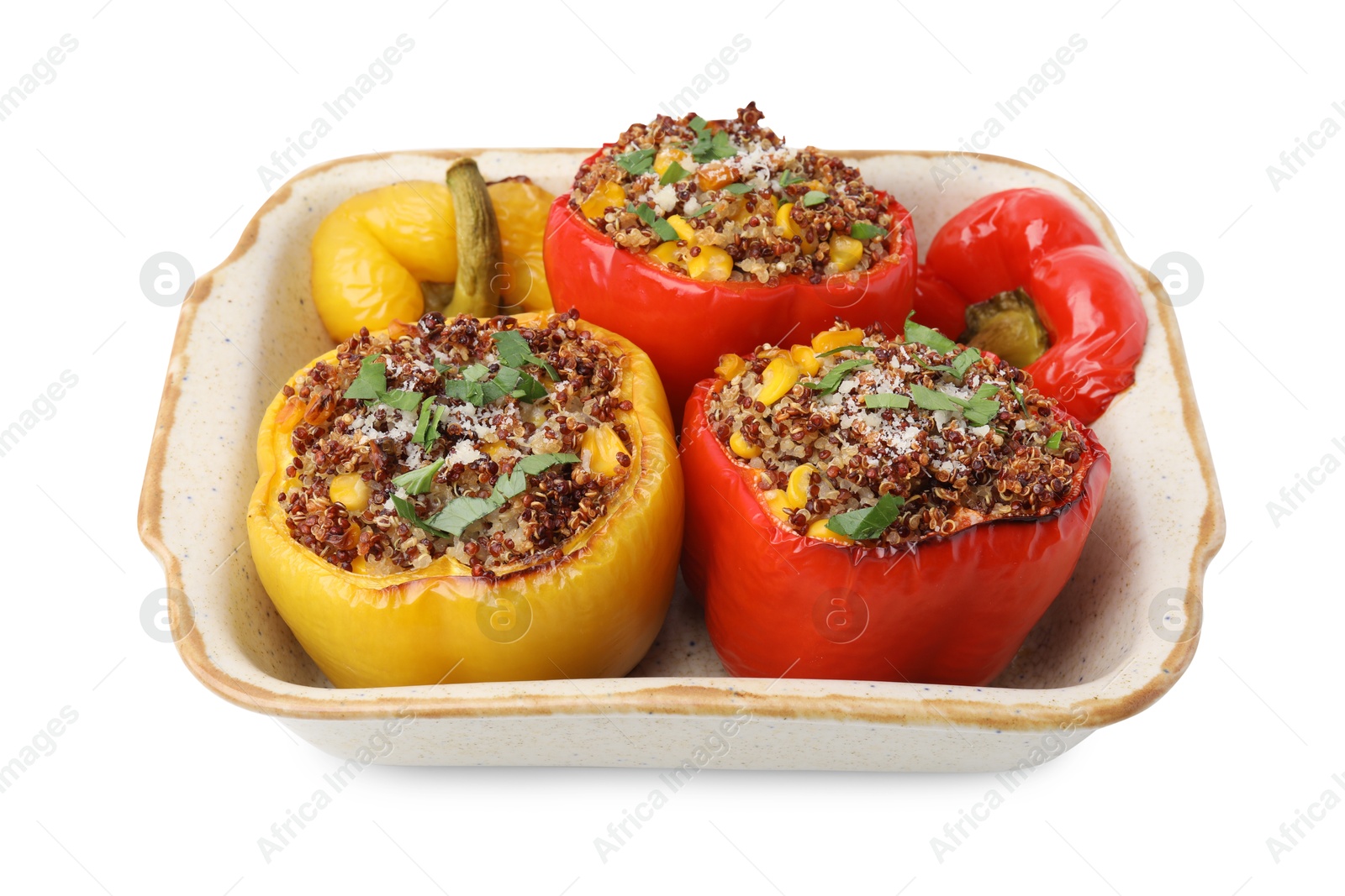 Photo of Tasty quinoa stuffed bell peppers with corn in baking dish isolated on white