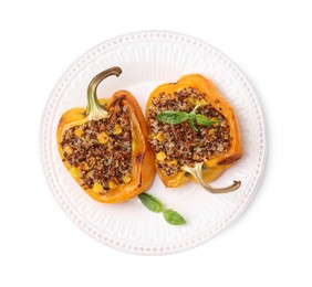 Photo of Quinoa stuffed bell peppers with corn and basil isolated on white, top view