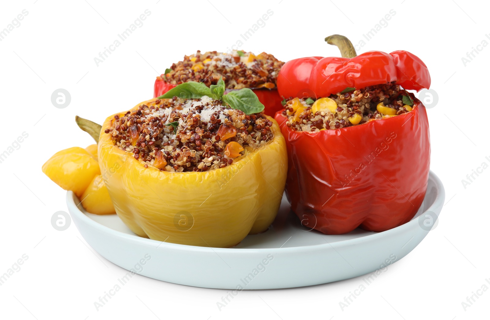 Photo of Quinoa stuffed bell peppers with corn and basil isolated on white