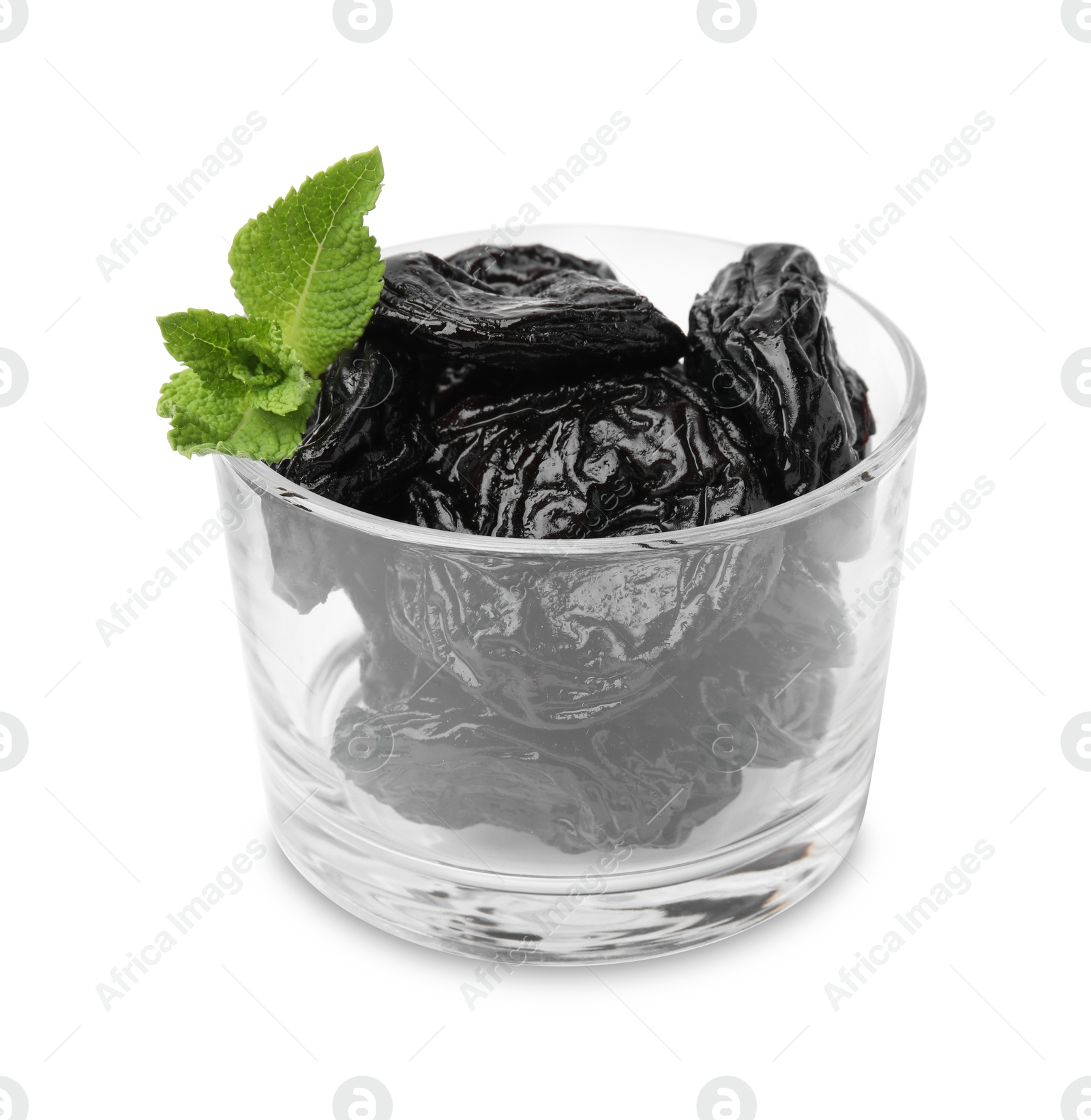 Photo of Tasty dried plums (prunes) in glass bowl and mint leaves isolated on white