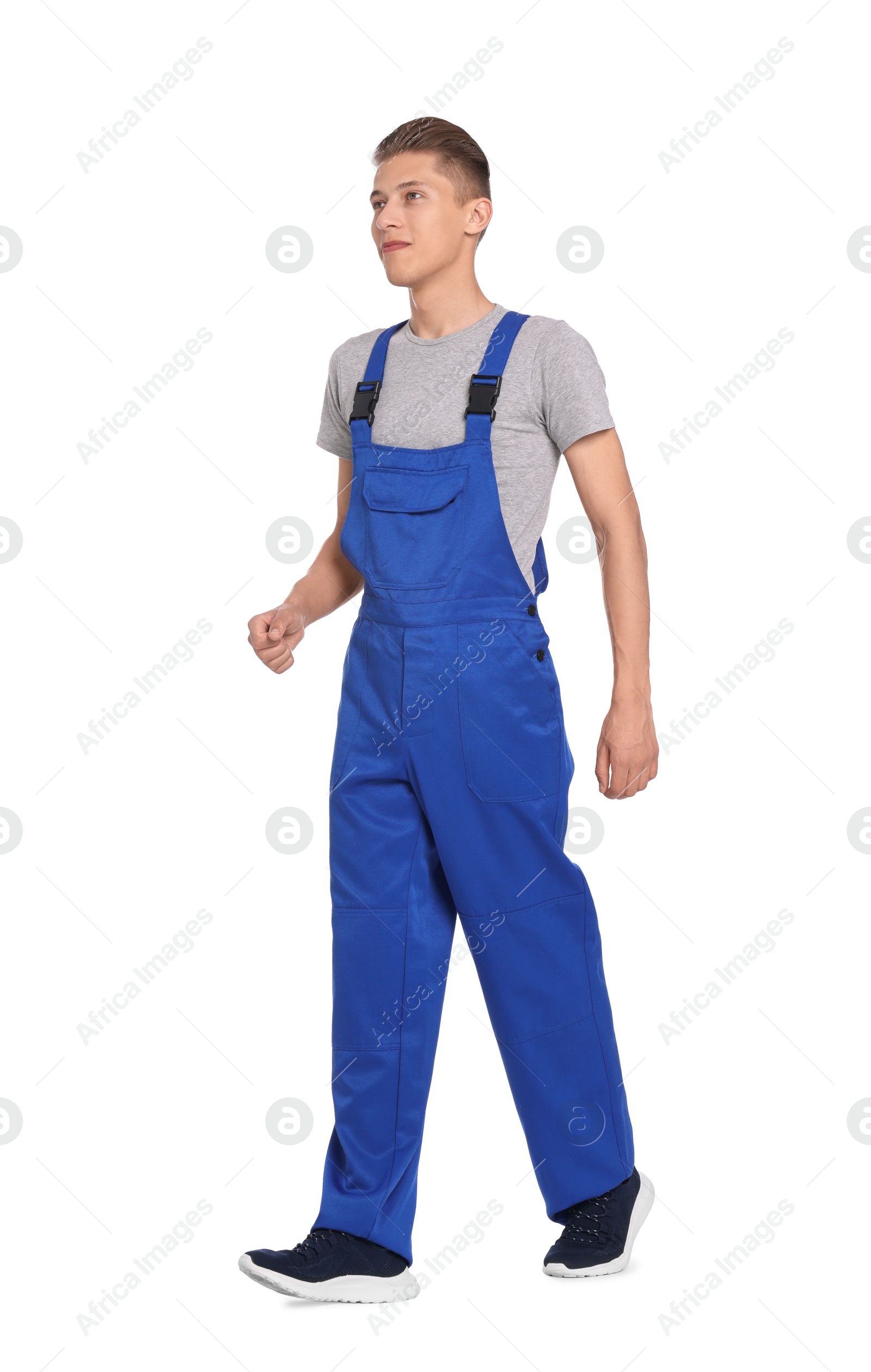 Photo of Auto mechanic in uniform on white background