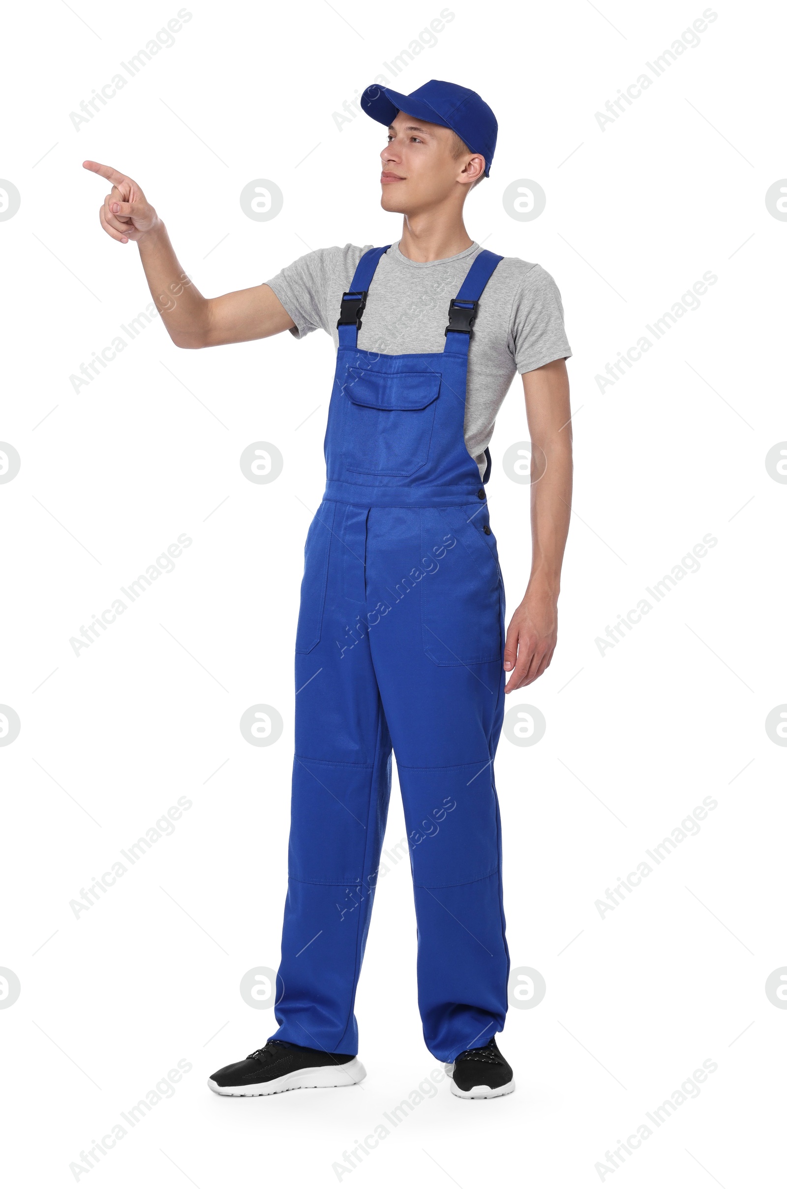 Photo of Auto mechanic pointing at something on white background