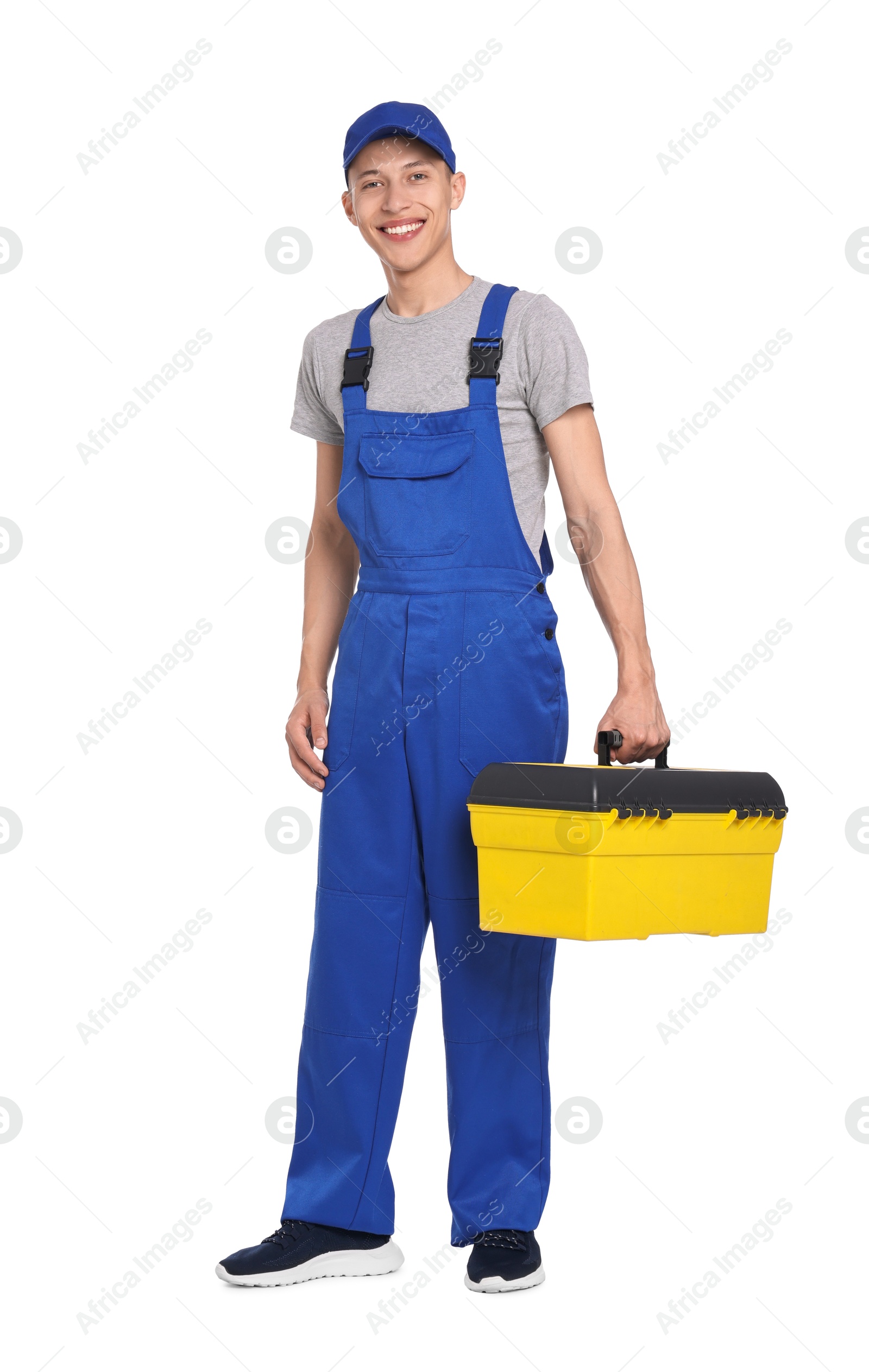 Photo of Smiling auto mechanic with tool box on white background