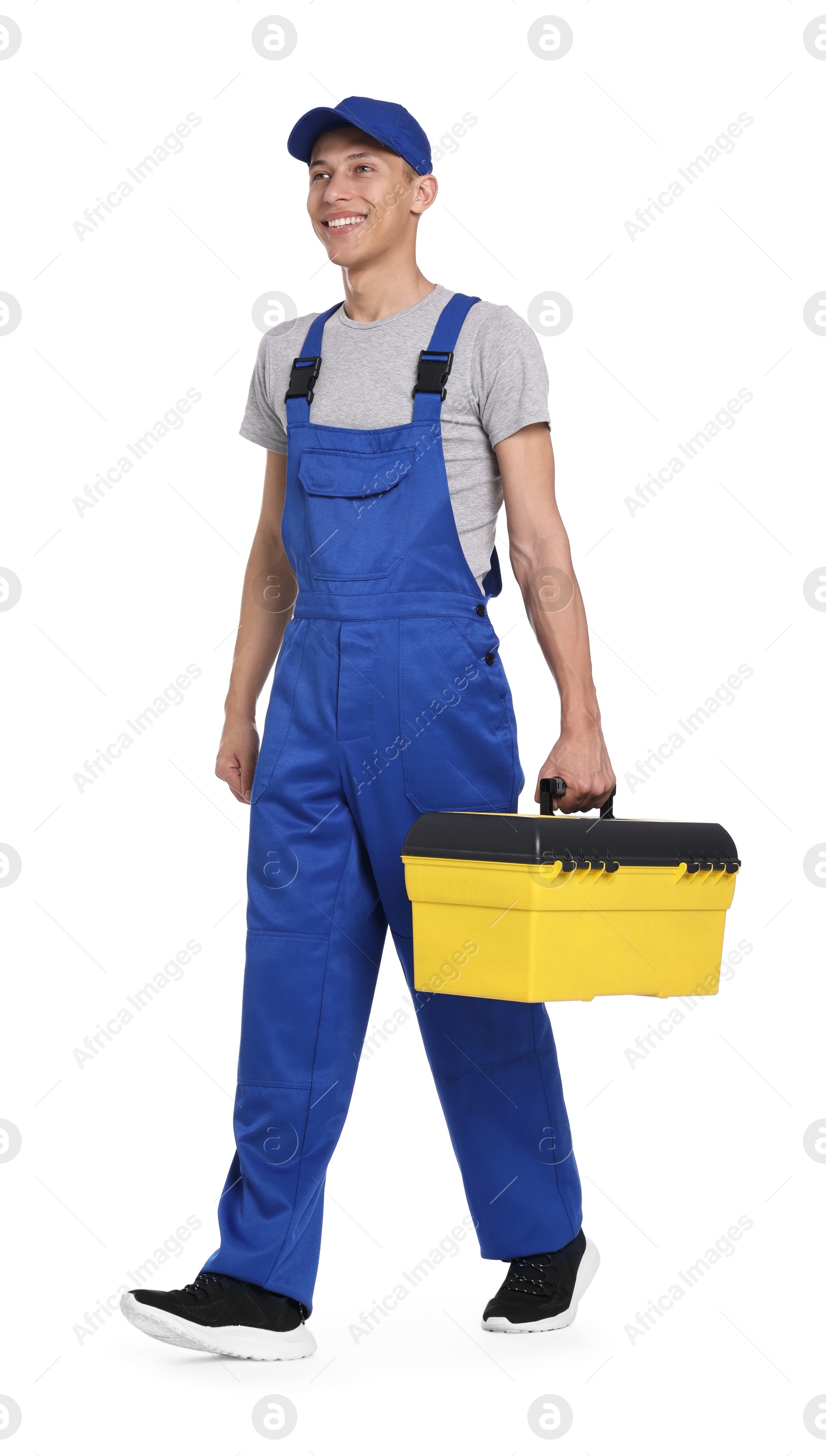 Photo of Smiling auto mechanic with tool box on white background