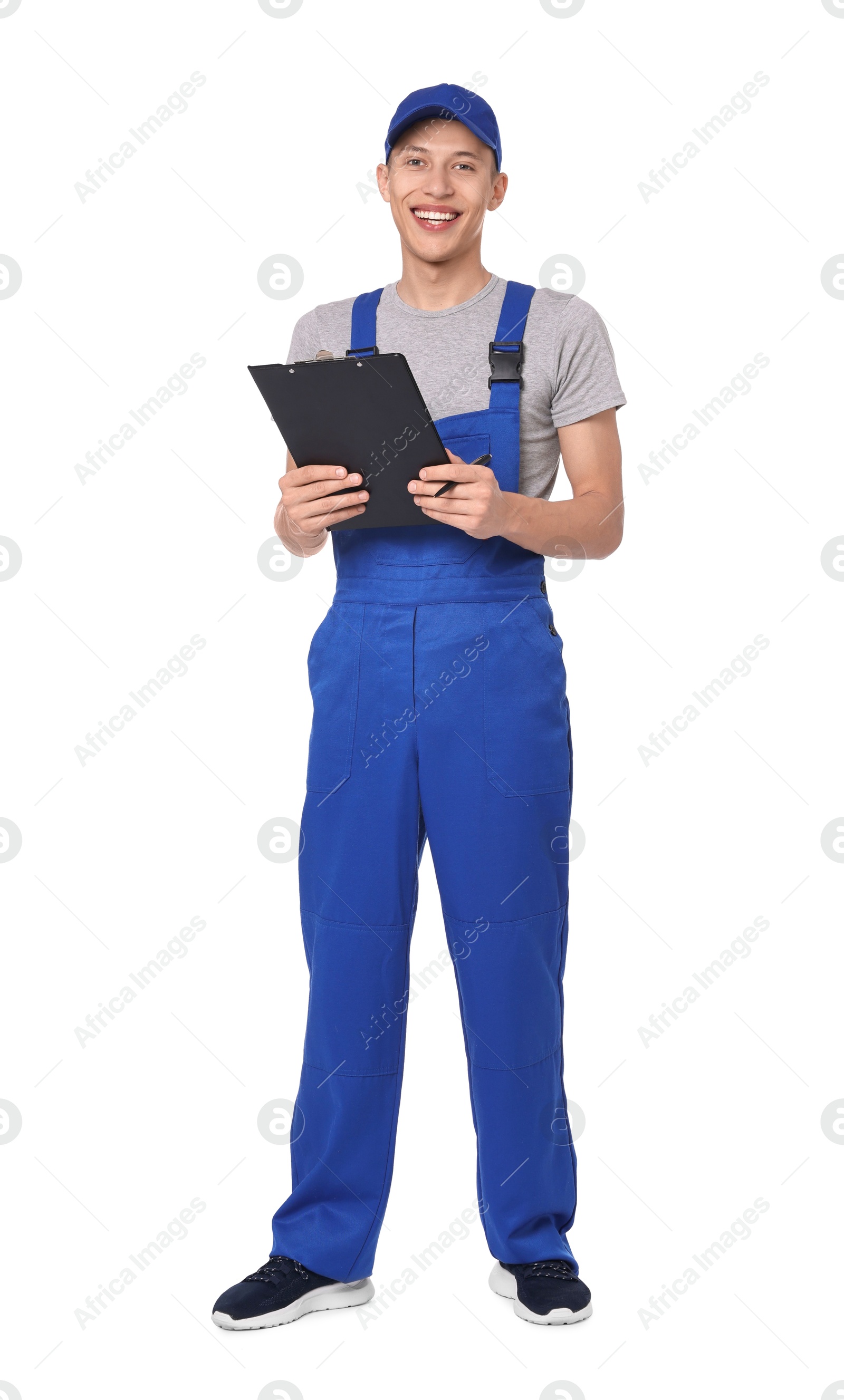 Photo of Smiling auto mechanic with clipboard on white background