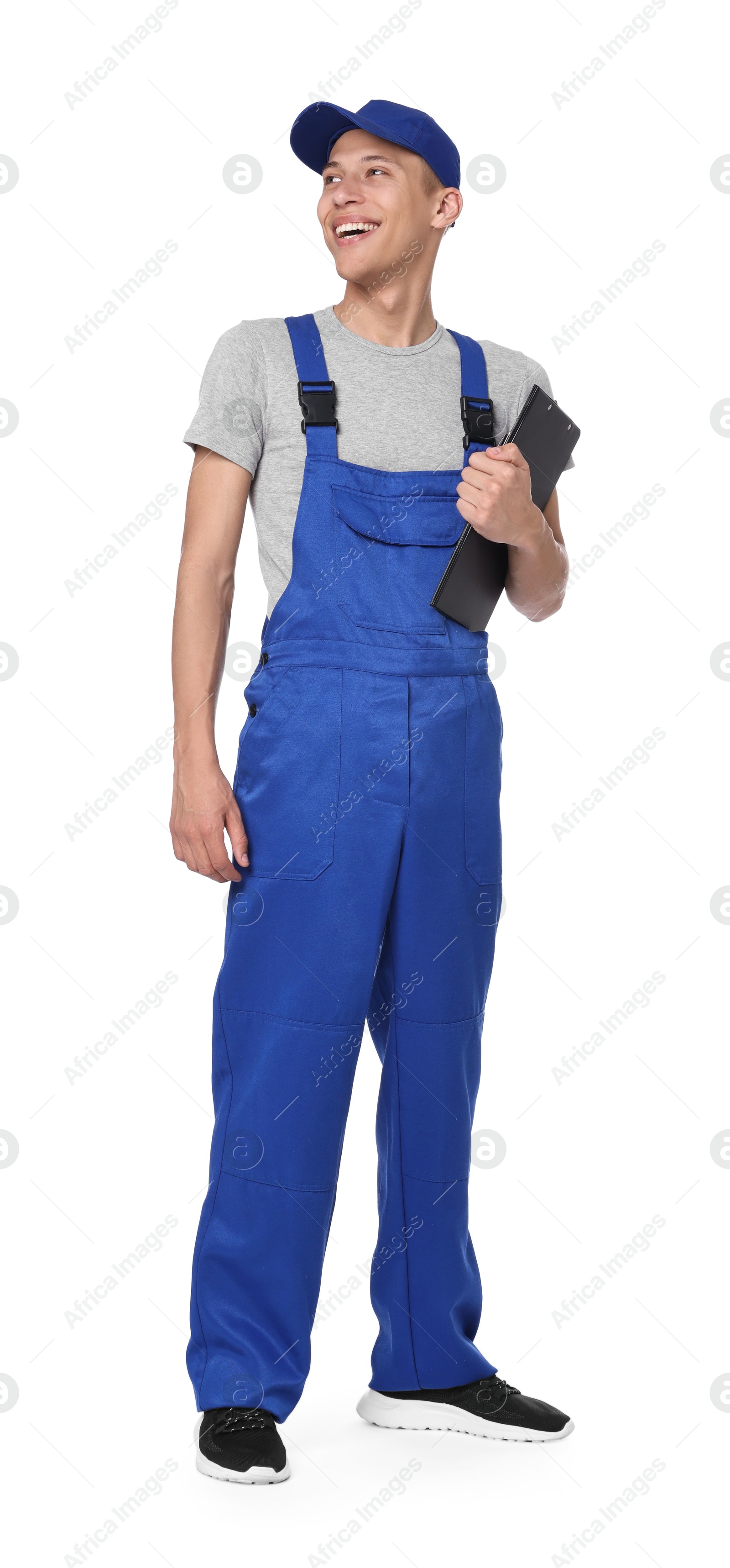 Photo of Smiling auto mechanic with clipboard on white background