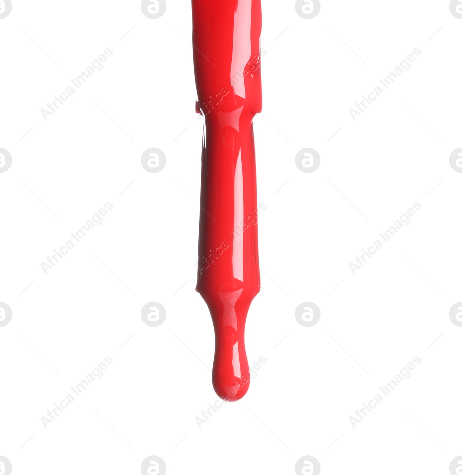 Photo of Red nail polish dripping from brush isolated on white