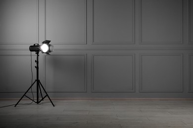 Professional lighting equipment in photo studio, space for text