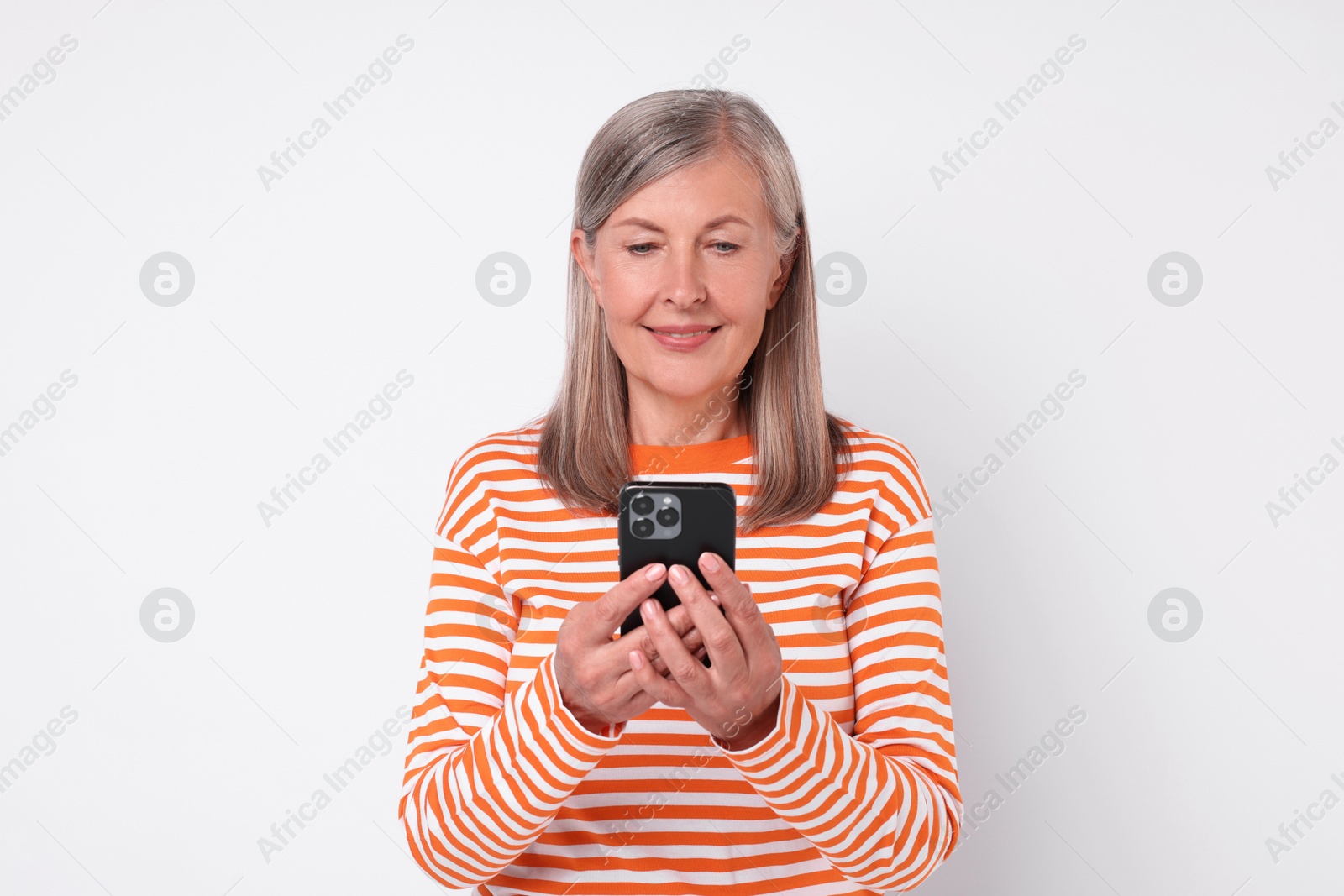 Photo of Senior woman with phone on light grey background