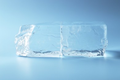 Blocks of clear ice on light blue background