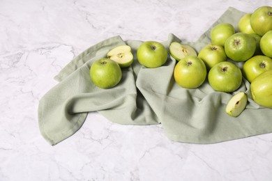 Photo of Fresh ripe green apples on white marble table