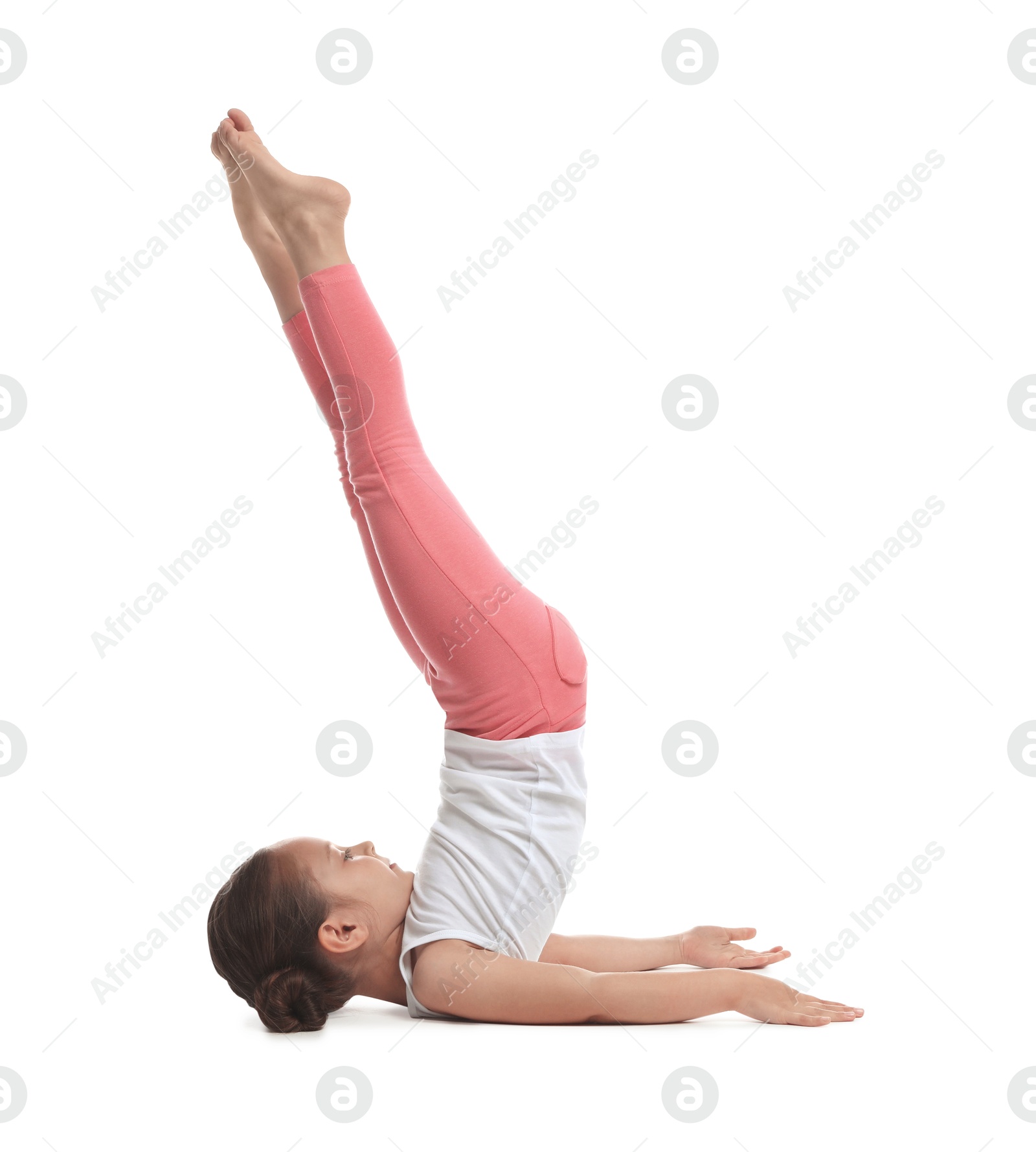 Photo of Cute little girl doing gymnastic exercise on white background