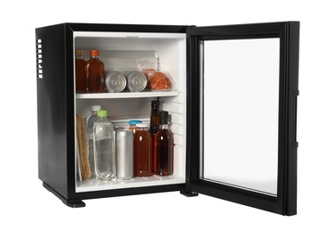 Photo of Mini refrigerator with drinks and snacks isolated on white