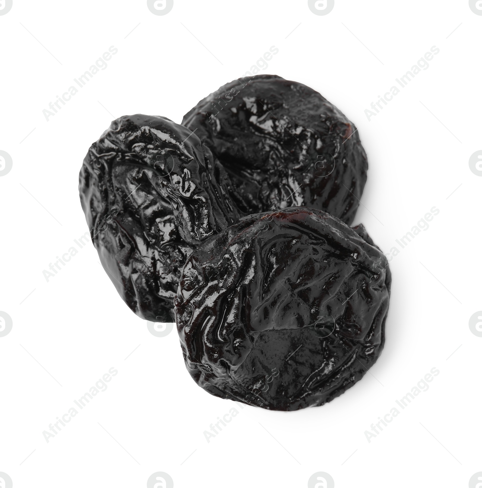 Photo of Tasty dried plums (prunes) isolated on white, above view