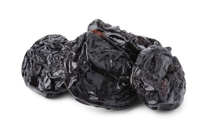 Tasty dried plums (prunes) on white background