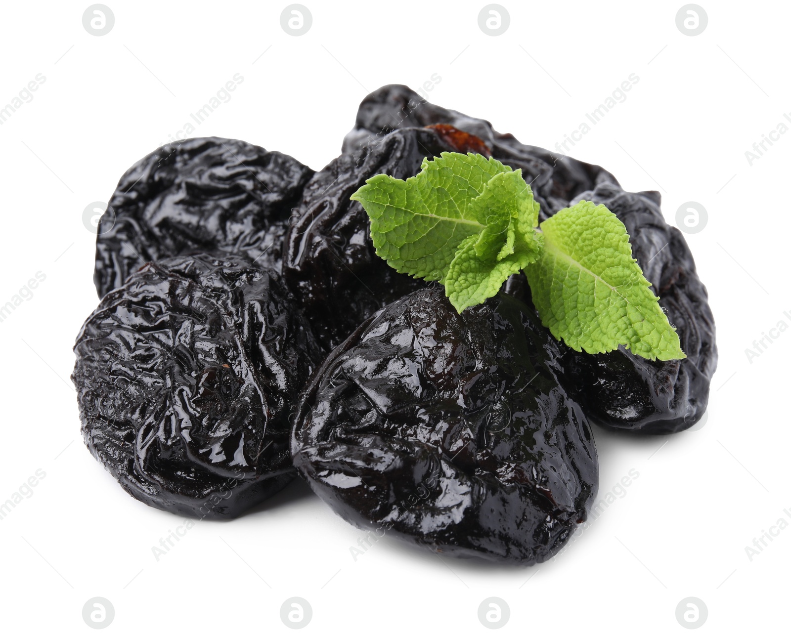 Photo of Tasty dried plums (prunes) and mint leaves on white background