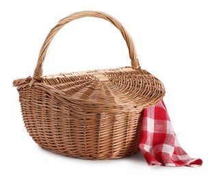 Photo of One picnic wicker basket with checkered napkin isolated on white