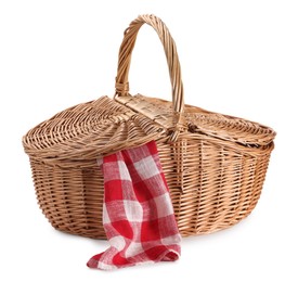 Photo of One picnic wicker basket with checkered napkin isolated on white