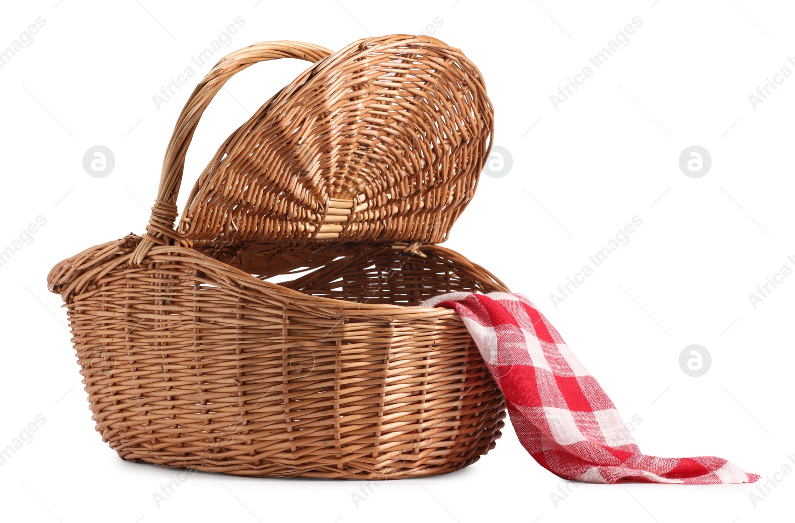 Photo of One open picnic wicker basket with checkered napkin isolated on white