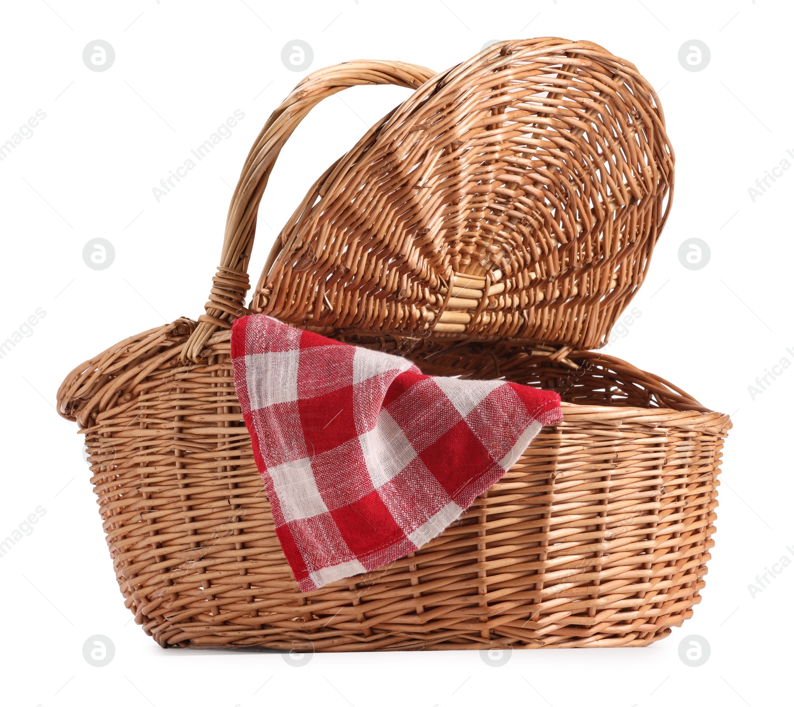 Photo of One open picnic wicker basket with checkered napkin isolated on white