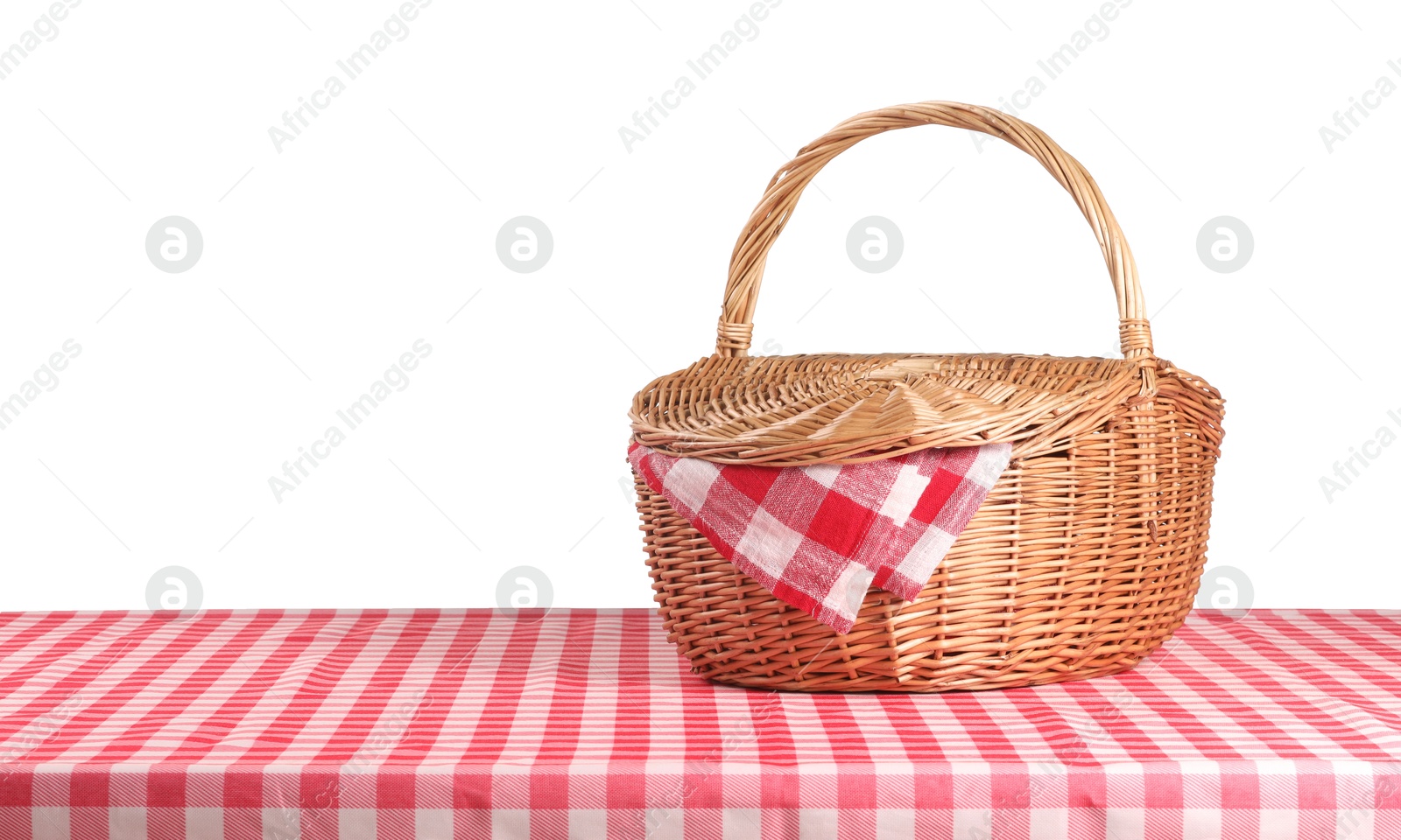 Photo of One picnic basket with napkin on table against white background. Space for text