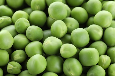 Photo of Fresh raw green peas as background, closeup