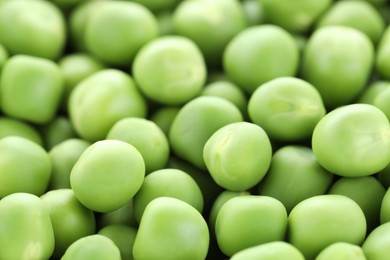 Photo of Fresh raw green peas as background, closeup