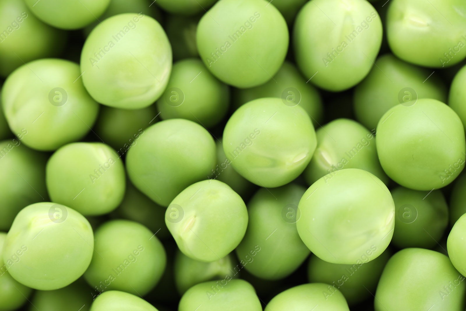 Photo of Fresh raw green peas as background, top view