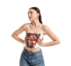 Beautiful woman in stylish corset on white background