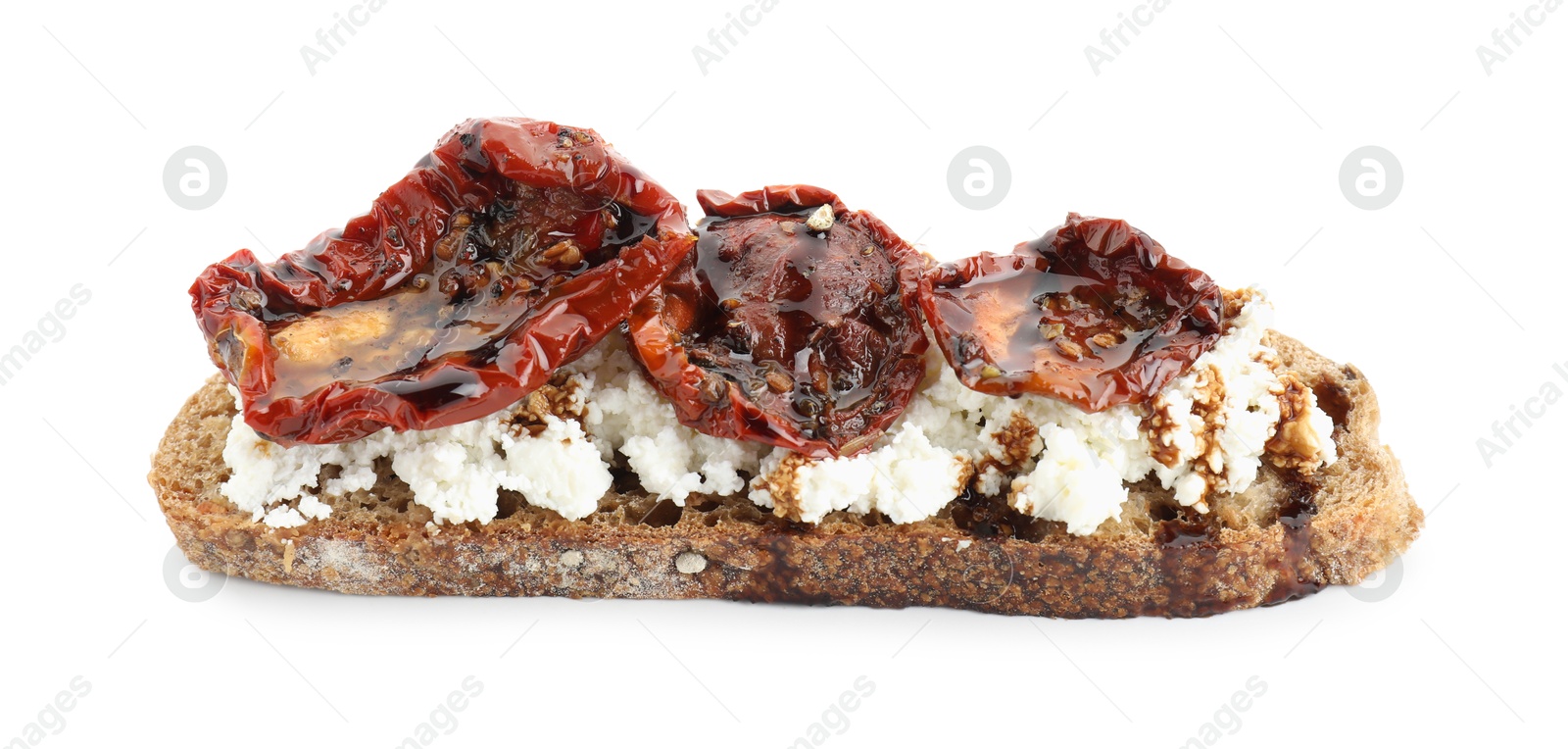 Photo of Delicious ricotta bruschetta with sun dried tomatoes and sauce isolated on white