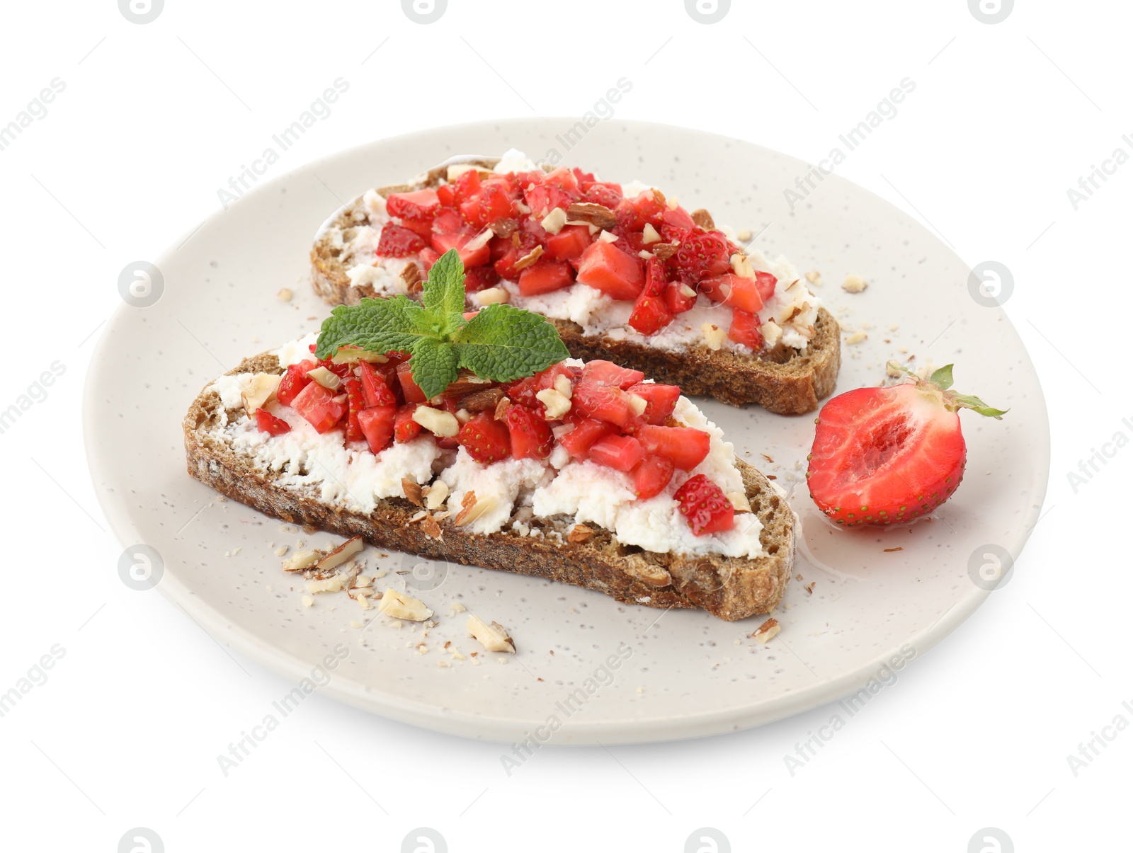 Photo of Delicious bruschettas with ricotta cheese, chopped strawberries and mint isolated on white