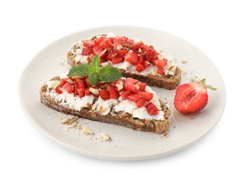 Delicious bruschettas with ricotta cheese, chopped strawberries and mint isolated on white