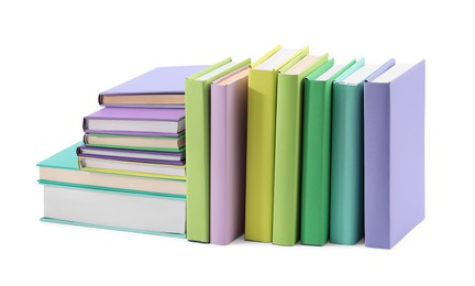 Many bright colorful books isolated on white