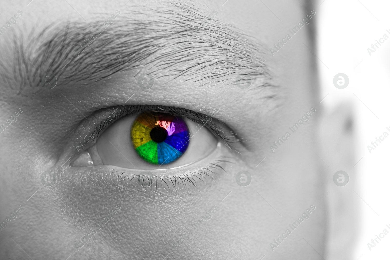 Image of Closeup of man's eye toned in rainbow colors