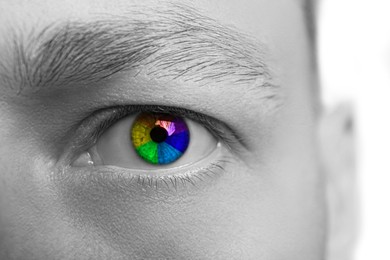 Image of Closeup of man's eye toned in rainbow colors