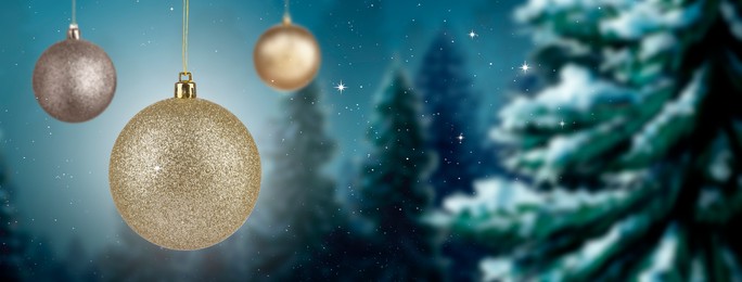 Image of Beautiful Christmas balls against snowy forest, banner design. Space for text