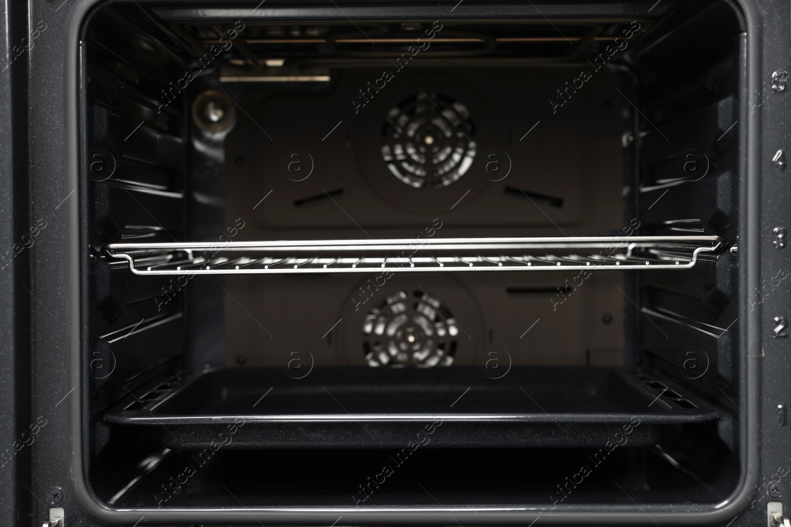 Photo of Open electric oven as background, closeup. Cooking appliance