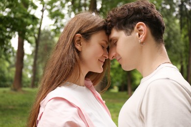 International dating. Lovely young couple spending time together in park