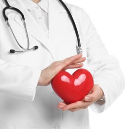 Photo of Doctor with red heart on white background, closeup