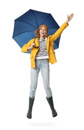 Woman with blue umbrella jumping on white background