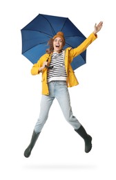 Photo of Woman with blue umbrella jumping on white background